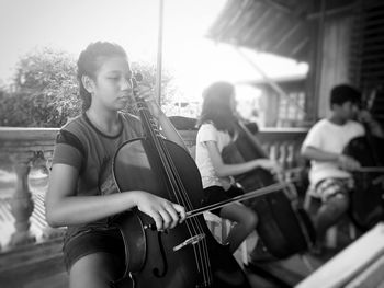 Teenagers playing violins