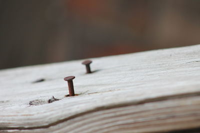 Close-up of rusty metal on table