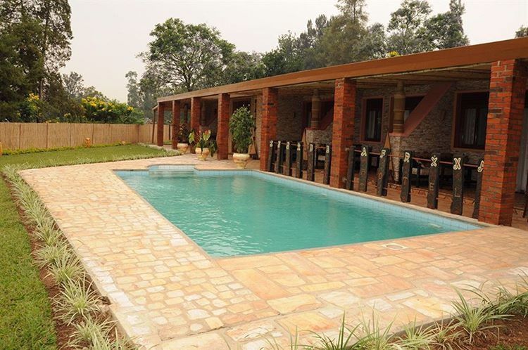 VIEW OF SWIMMING POOL IN THE BACKGROUND