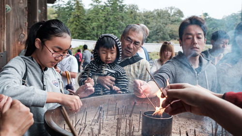 Group of people with hands in the background