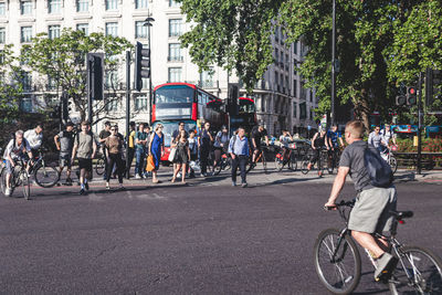 People riding bicycle on city street