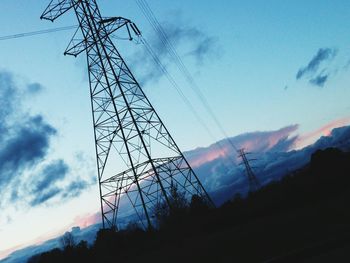 Low angle view of electricity pylon against sky