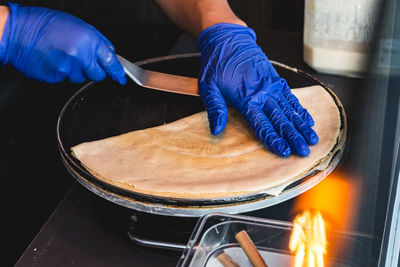 Midsection of man preparing food