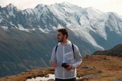 Young man standing on mountains