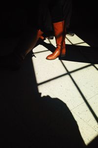 Low section of woman standing on floor