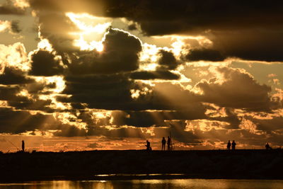 Scenic view of dramatic sky over sea during sunset