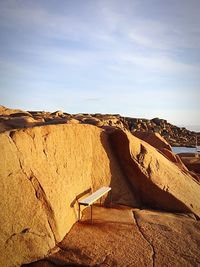 Rock formations on landscape against sky