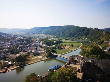 High angle view of river amidst buildings against sky