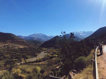 Scenic view of mountains against clear blue sky