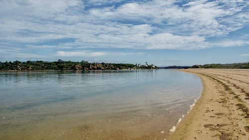 Scenic view of beach against sky