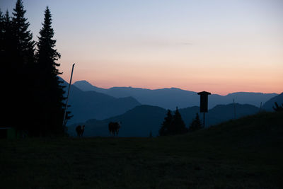 Scenic view of silhouette mountains against sky during sunset