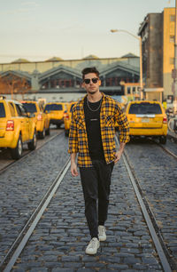 Full length of man standing on road against sky