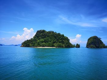 Scenic view of sea against blue sky