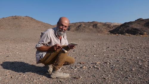 Archaeologist at work in the desert 