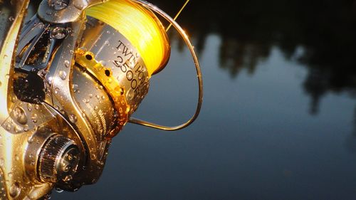 Close-up of wet equipment over lake