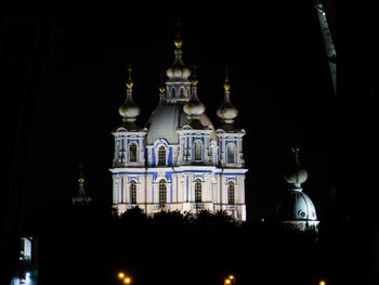 Low angle view of illuminated building at night