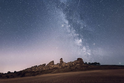 Scenic view of star field against sky at night