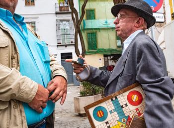 Man using mobile phone in city