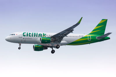 Low angle view of airplane against clear sky