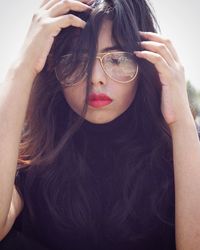 Close-up of young woman wearing eyeglasses