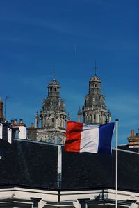 Low angle view of building against blue sky