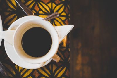 Close-up of coffee cup on table