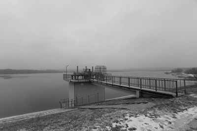 Pier on sea against sky