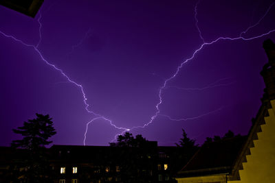 Low angle view of lightning in sky at night