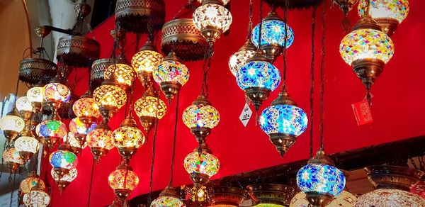 Low angle view of illuminated lanterns hanging in market