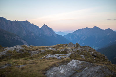 Scenic view of mountains against sky at sunset