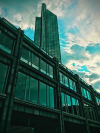 Low angle view of building against cloudy sky