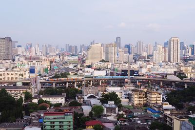 Buildings in city against sky