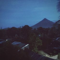 Scenic view of mountains against clear sky at night