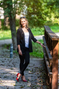 Full length portrait of woman smiling