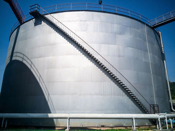 Closeup molasses storage tank.