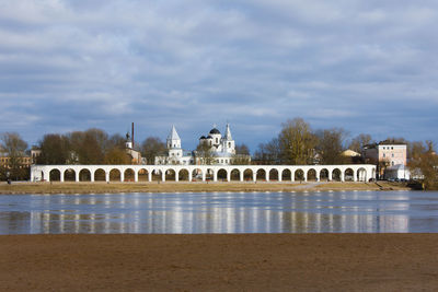 View of bridge over river against cloudy sky