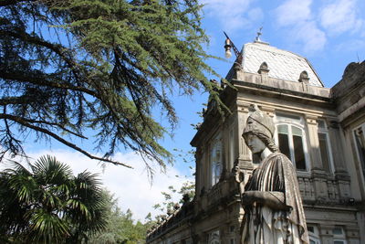 Low angle view of statue against sky