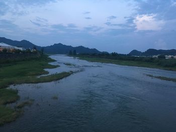 Scenic view of river against sky