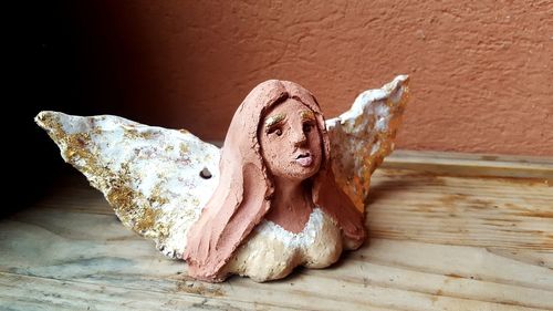 Close-up of stuffed toy against wall
