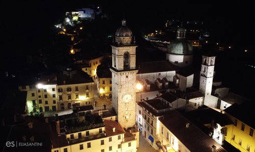 High angle view of illuminated buildings in city at night