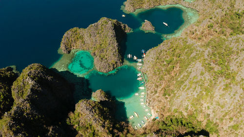 Aerial view tourist boats in lagoons. kayangan lake. seascape,tropical landscape.palawan,philippines