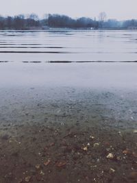 Frozen lake against sky