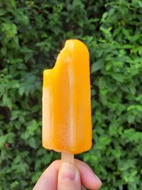 Cropped hand holding ice cream cone