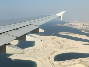 Airplane wing over landscape