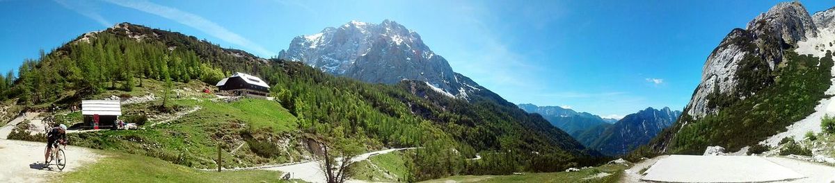Scenic view of mountains against blue sky