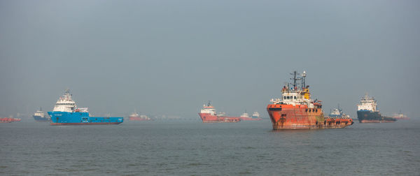 Ship in sea against clear sky