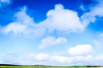 Scenic view of landscape against cloudy sky