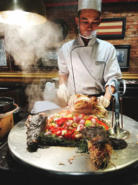 Man preparing food in restaurant