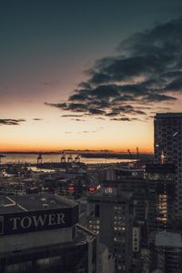 High angle view of illuminated buildings against sky at sunset