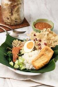 Nasi pecel. traditional javanese rice dish of steamed rice with vegetable salad, 